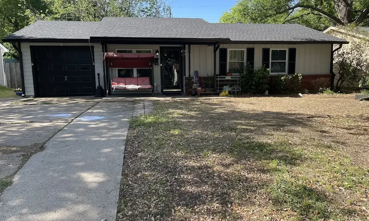 Asphalt Shingle Roof Repair crew at work on a residential roof in Vero Lake Estates